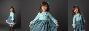 little girl holding dress and twirling in photo how to take good pictures kristina rose photography